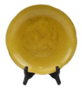 HONGZHI MARKED INCISED YELLOW GLAZED DRAGON CHARGER 大明弘治款黄地暗花龙纹盘