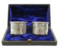 CASED PAIR OF VICTORIAN HALLMARKED SILVER NAPKIN RINGS