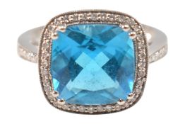 14CT WHITE GOLD TOPAZ & DIAMOND HALO RING