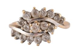 A 9CT GOLD & WHITE STONE CLUSTER RING