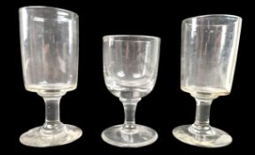 THREE EARLY 19TH CENTURY BLOWN GLASS RUMMER GLASSES