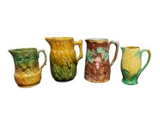 FOUR 19TH CENTURY VICTORIAN MAJOLICA PITCHERS / JUGS