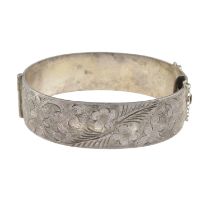 Silver hinged bangle, with foliate detail