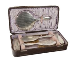 A cased silver mounted Ladies Dressing Set,  Birmingham 1925 by Davis, Moss & Co. (1)