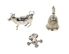 A plain Chester silver Cow Creamer, c. 1910, maker B.M., an attractive embossed silver Table Bell,