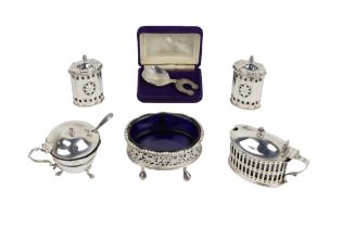 Silverware:  A pair of attractive Georgian style silver bright-cut and pierced Salt and Pepper, by
