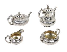 An attractive English silver four piece Service, decorated in the Chinese taste, by Joseph and