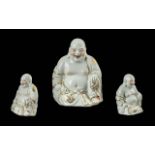Modern Buddha Figure, seated smiling Buddha in white with gilt decoration. Measures 9'' high x 7''