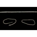 18ct White Gold Line Bracelet - Set With White Faceted Stones. Marked 18ct. Gross Weight 6.5 Grams.