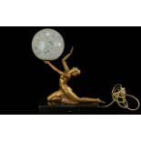 Art Deco Gilt Spelter Figural Table Lamp modelled as a nude lady in pose holding aloft a spherical