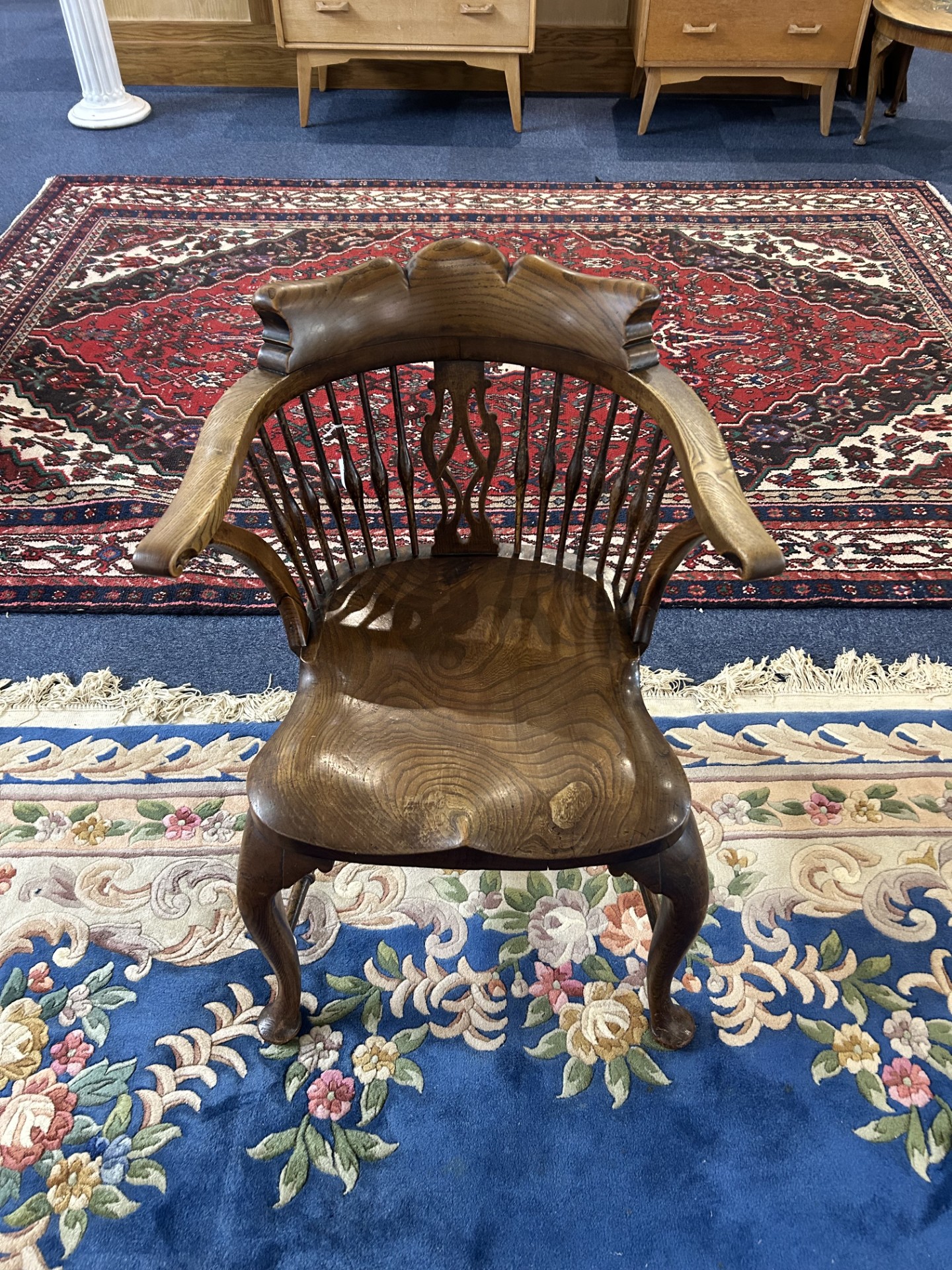 Captain's Chair, traditional style in oak. Slatted curved back, stretcher.