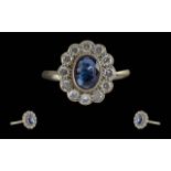 Ladies 18ct White Gold Diamond / Sapphire Set Cluster Ring. Marked 18ct to Interior of Shank. The