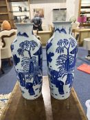 Pair of Japanese Vases, blue and white pattern, marks to base. 15'' high.