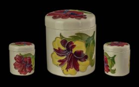 Moorcroft Lidded Pot ' Hibicus ' on Cream Ground. Height 4 Inches.