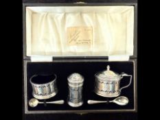 Silver Cruet Set, in fitted box, comprising pepper, salt with blue liner, mustard and two spoons.