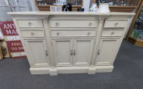 A Stanley Furniture Company Limed Oak Sideboard/Buffet Table, with six drawers above cupboards.