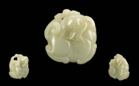 Carved Jade Pendant, appears to be a sylised elephant. Measures approx. 1.25'' square.