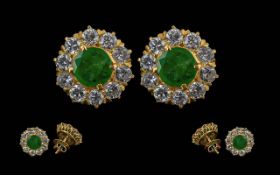 A Fine Pair of 18ct Gold Diamond and Emerald Set Pair of Earrings. Marked 18ct. The Central