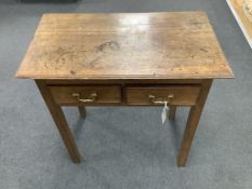 A small 18th century oak two drawer side table, width 69cm, depth 39cm, height 70cm. Condition -