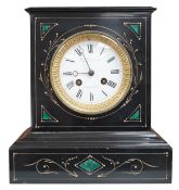 A late 19th century, French black marble eight day mantel clock, inset with malachite, retailed by