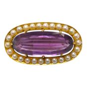 An early 20th century yellow metal mounted amethyst and split pearl cluster set oval brooch, 32mm,