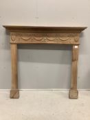 An Adam design pine fire surround, width 128cm, height 118cm. Condition - fair to good