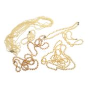 Six assorted modern single strand cultured pearl necklaces, one with 14k clasp, longest 86cm, a pair