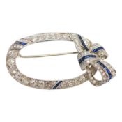 A yellow and white metal, sapphire and millegrain set diamond cluster oval open work brooch, with