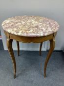 A Louis XVI style circular banded kingwood marble top centre table, diameter 65cm, height 71cm.