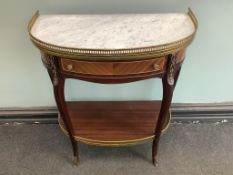 A Louis XVI style gilt metal mounted mahogany two tier marble top side table, width 62cm, depth