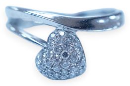 A modern 18k white metal and pave diamond set heart shaped ring, size H, gross weight 2.1 grams.