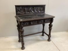 A late 19th century Flemish style carved oak side table, width 109cm, depth 53cm, height 116cm.
