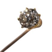 A yellow metal and solitaire diamond set interchangeable stick pin/dress stud, the stone diameter