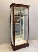 An early 20th century mirrored oak shop display cabinet, width 80cm, depth 47cm, height 189cm.