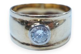 A 750 yellow metal and collet set solitaire diamond set band, stone diameter approx. 5.4mm, size
