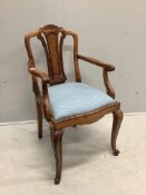 An early 20th century French carved beech and walnut elbow chair, width 56cm, depth 51cm, height