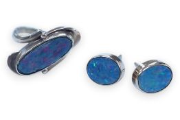 A 9ct and opal doublet ring and a pair of similar earrings, gross weight 4.8 grams. Condition -