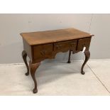 An 18th century style oak kneehole dressing table on cabriole legs, width 105cm, depth 53cm,