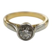 A yellow metal and collet set solitaire diamond set ring, size J/K, gross weight 4.2 grams.