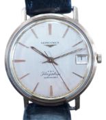 A gentleman's 9ct gold Longines Flagship automatic wrist watch, with baton numerals and date