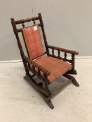 A late 19th century American turned beech child’s rocking chair, width 39cm, depth 49cm, height