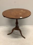 A George III circular mahogany tilt top tripod tea table, diameter 69cm, height 72cm. Condition -
