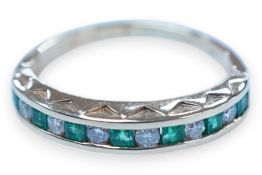 A modern 18k, seven stone emerald and six stone diamond set half hoop ring, size F/G, gross weight