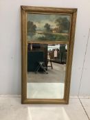 A Victorian style gilt framed trumeau wall mirror, with painted lake landscape, width 64cm, height