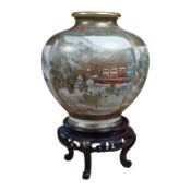 A Japanese Satsuma pottery vase decorated with figures and landscapes, signed Choshuzan to the base,