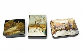 Three late 19th/early 20th century Russian lacquer boxes, decorated with snow scenes, largest 13.