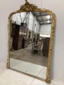 A Victorian giltwood and composition overmantel mirror with cartouche pediment, width 140cm,