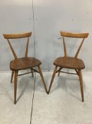 A pair of mid century Ercol elm and beech stacking chairs, width 39cm, depth 35cm, height 76cm.