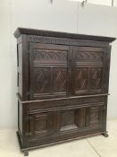 A late 17th century Continental carved oak two section cupboard, width 166cm, depth 57cm, height
