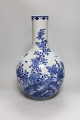 A large Chinese blue and white bottle vase, 46cms high. Condition - good